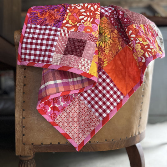 "In the Red" New and Upcycled Fabric Sofa Quilt